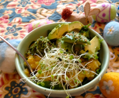 Kitchari with greens and sprouts and avocado.